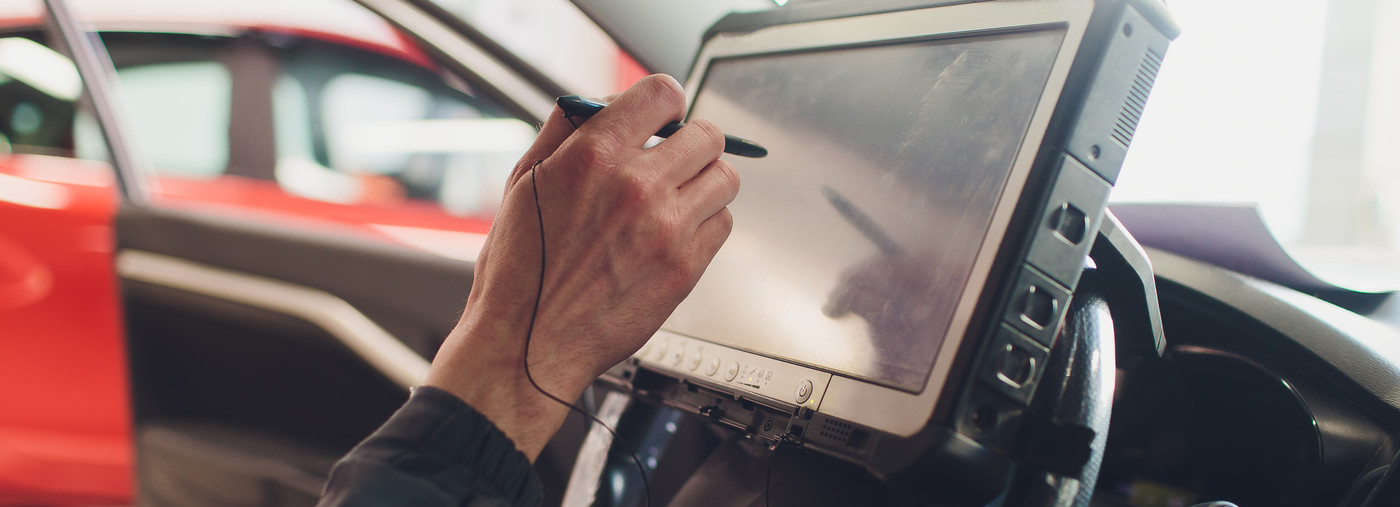 Mechanic using a computer screen - Car Diagnostics Southmead